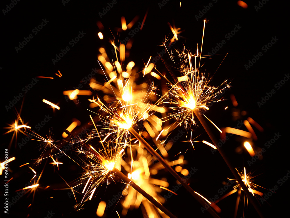 Close up several firework sparklers over black Close up several firework sparklers over black