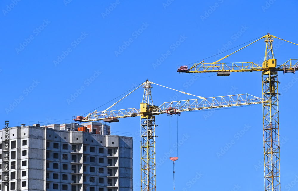 Crane and highrise construction site Crane and highrise construction site