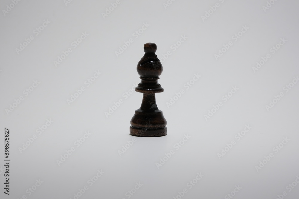 Black wooden chess bishop isolated on a white background. Black wooden chess bishop isolated on a white background.