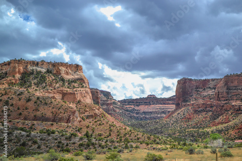 Colorado National Monument in stormy skies. Red sandstone plateaus seen as storm clouds hover near Grand Junction, Colorado.