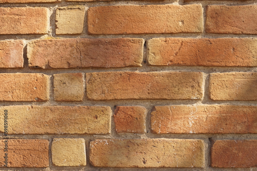 Obraz premium Background old red brick wall in sunny day.