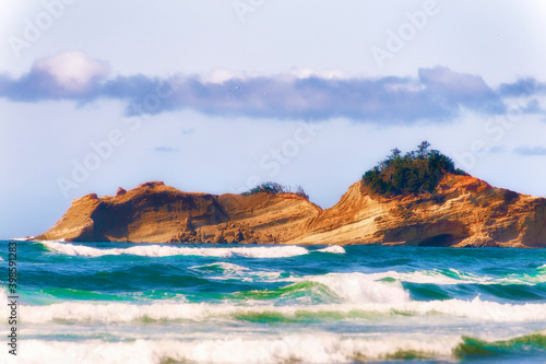 Sandstone hills jut out into the ocean