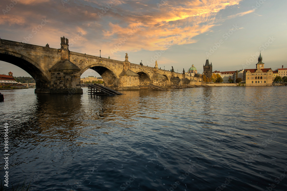 panorama stones charles bridge over vltava river and blue sky at sunset in the center of prague
