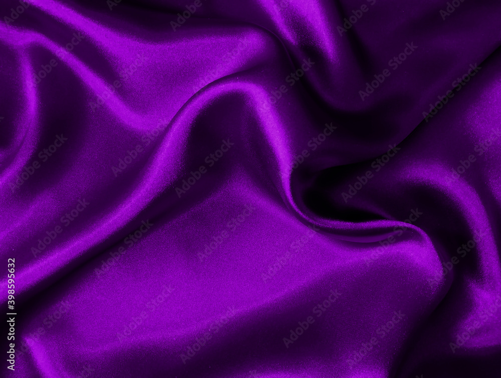Fototapeta premium Shiny purple crumpled fabric texture. Elegant wavy cloth background