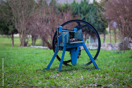 Slika na platnu Old chaff cutter in the garden