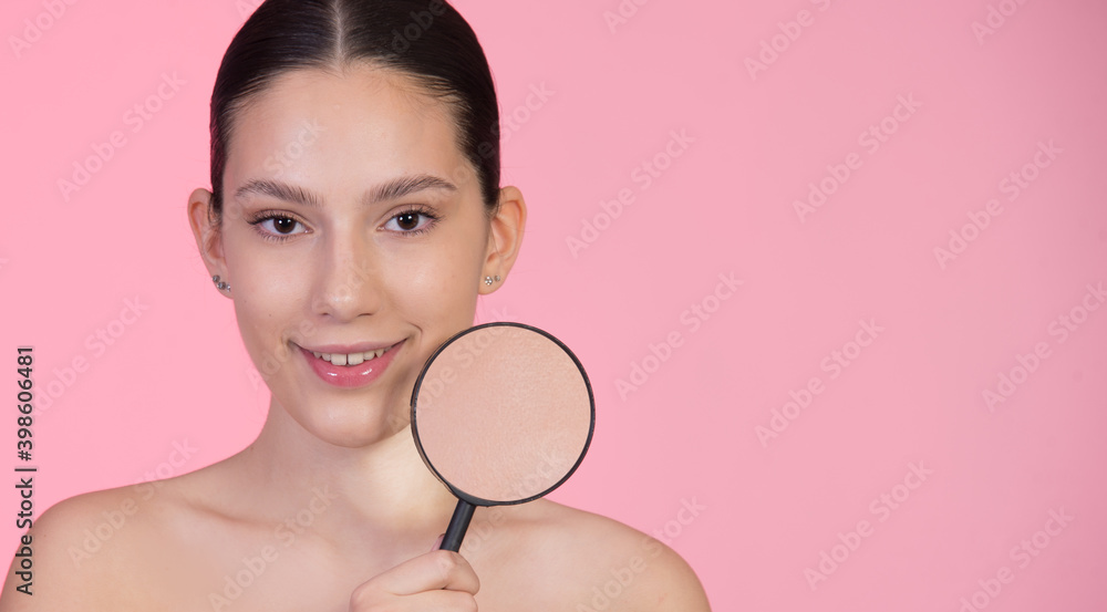Beauty, skin care product concept. Portrait of girl holding magnifier over skin on her face. Beautiful young girl with dry problematic skin, acne problem concept. Horizontal banner with copy space Beauty, skin care product concept. Portrait of girl holding magnifier over skin on her face. Beautiful young girl with dry problematic skin, acne problem concept. Horizontal banner with copy space