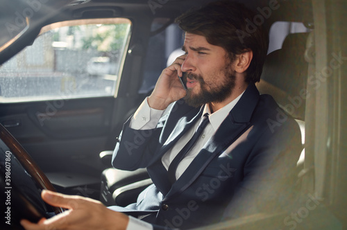 man in a suit driving a car success official talking on the phone © SHOTPRIME STUDIO