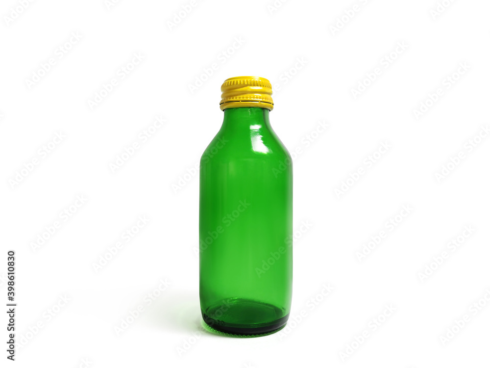 Green glass bottle with yellow lid on white background Green glass bottle with yellow lid on white background