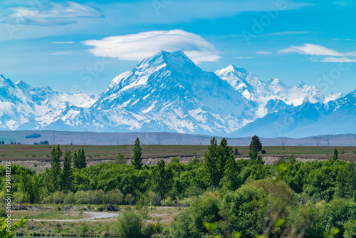 Famous Mount Cook in distance still snow-capped in spring photo