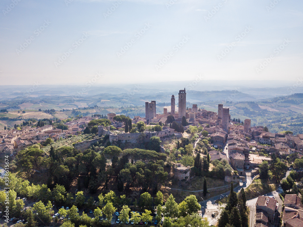 Aerial view of San Gimignano skyline at sunrise, a medieval town with ancient towers in Tuscany, Italy