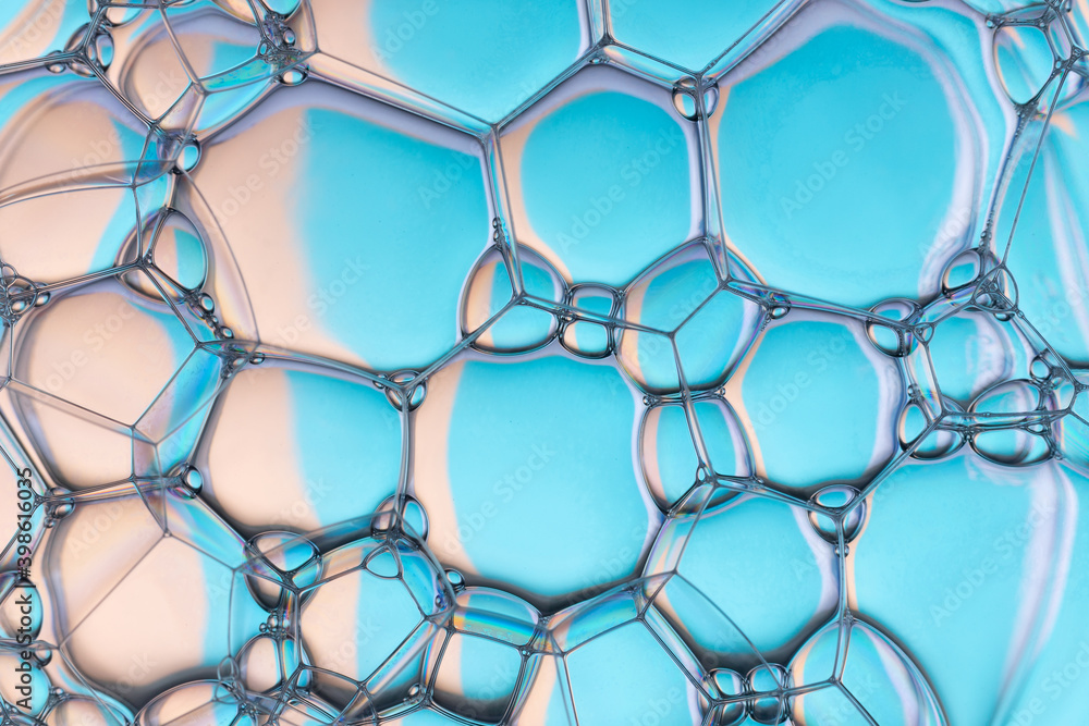 Naklejka premium Soap bubbles on the water abstract background.
