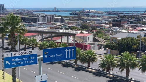 Cape Town Harbour and industrial area of Woodstock with pedestrian bridge over Nelson Mandela boulevard taken from Walmer Estate photo