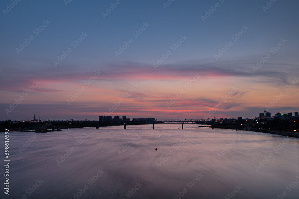 Beautiful city landscape, sunset over the city of Novosibirsk, Ob river