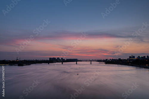 Beautiful city landscape, sunset over the city of Novosibirsk, Ob river © Ernest Vursta