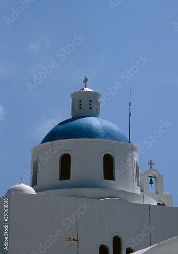 View of Santorini blue domed church and Church bells in Santorini, Greece. 