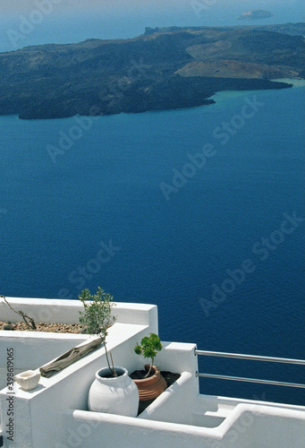 View of Santorini blue color sea and caldera with white house roof and balcony in Santorini, Greece. 