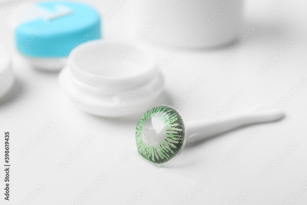 Contact lens with container on white background Contact lens with container on white background