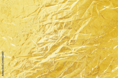 fabric gold wrinkled or crumpled textile texture abstract background.