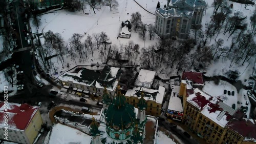 Aerial top view of Saint Andrew's church and Andreevska street from above, cityscape of Podol district, city of Kiev (Kyiv), Ukraine photo