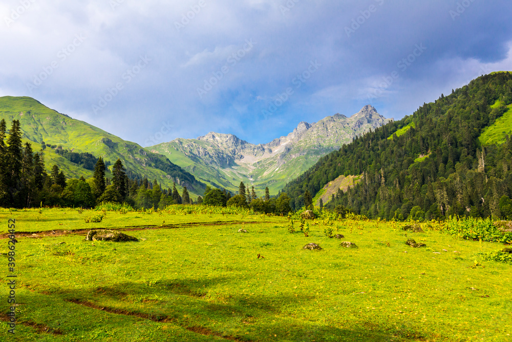 Scenery mountain landscape at Caucasus mountains with clouds.