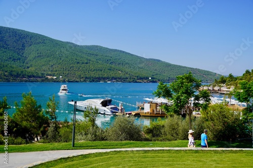 Bodrum, Turkey - August, 2020 Beautiful summer landscape with turquoise lake, mountains and blue sky, beach, yachts