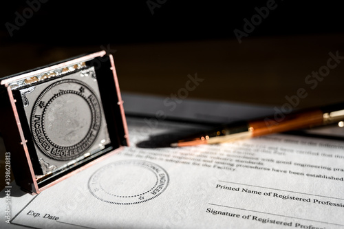 Selective focus on generic professional engineer, architecture. or surveyor stamp and certification statement photo