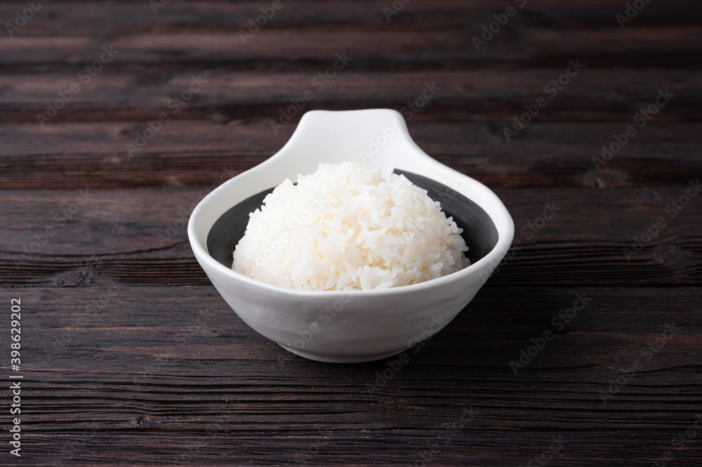 Bowl of boiled rice served on wooden table, Bowl of boiled rice served on wooden table,