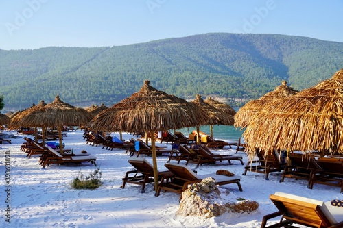Bodrum, Turkey - August, 2020 Tropical beach panorama as summer landscape with white sand and calm sea for beach banner. Tranquil beach scene vacation and summer holiday concept. Boost up color