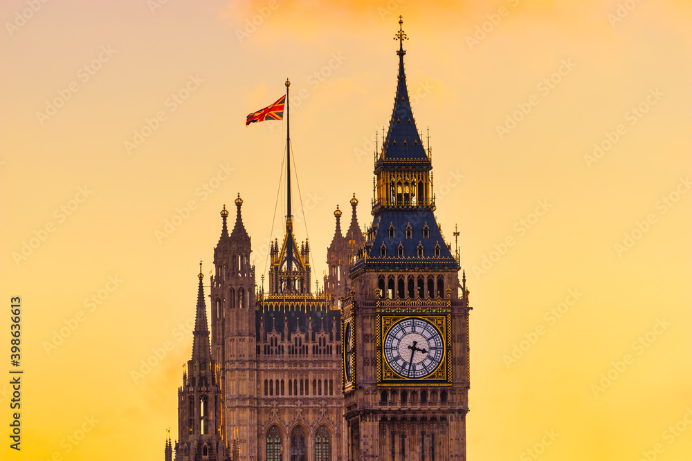 Big Ben clock tower in London with sunset sky