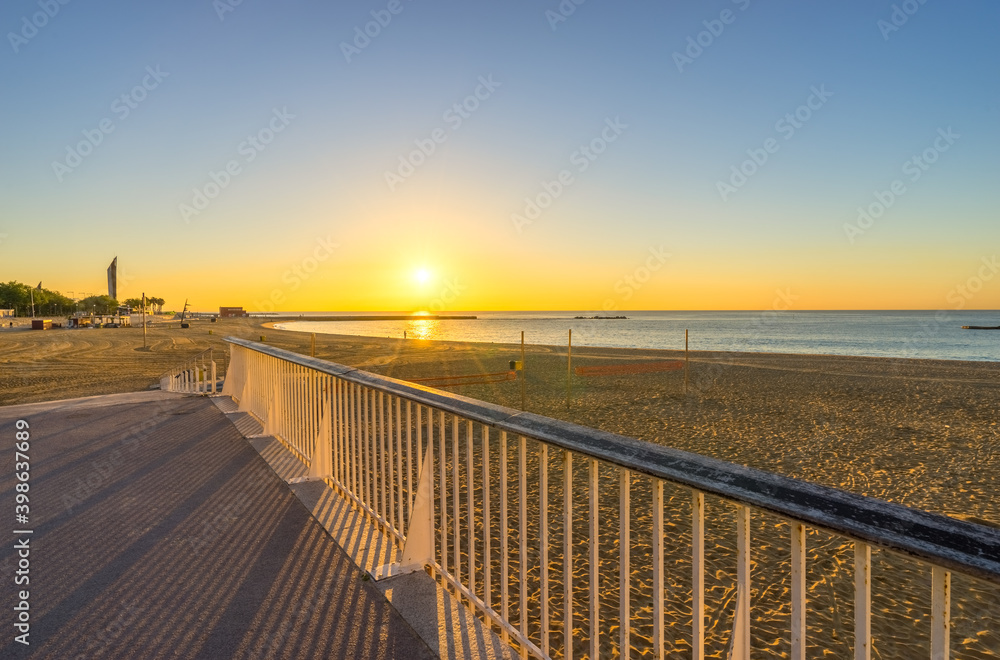 Barceloneta Beach at sunrise in Barcelona, Spain Barceloneta Beach at sunrise in Barcelona, Spain