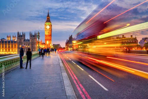Big Ben at sunset with blurry bus in motion. London. England