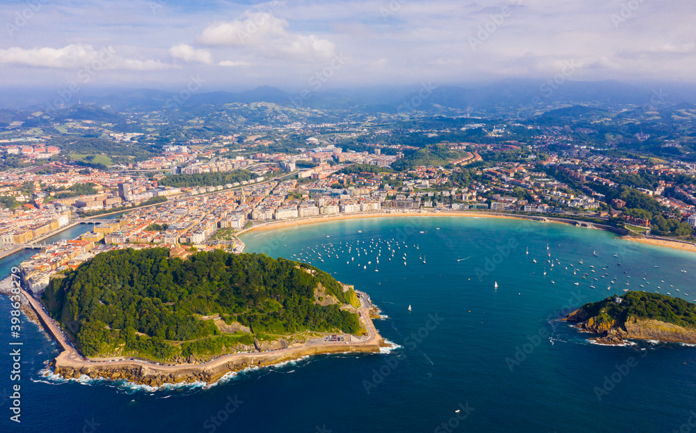 High view of San-Sebastian with Beach of La Concha and boats at sea, Spain