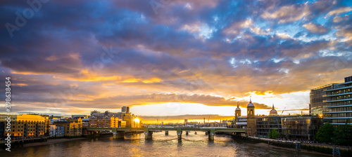 Sunset panorama of Southwark bridge in London, England