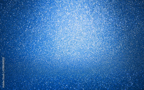 Abstract blue glitter texture background Defocused. Concept for decoration, holiday, Wallpaper,Christmas.