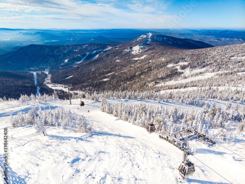 Sheregesh ski lift resort in winter, landscape on mountain and hotels, aerial top view Kemerovo region Russia © Parilov
