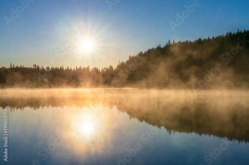Fototapeta Naklejka Na Ścianę i Meble -  Sunrsise at the lake with morning fog