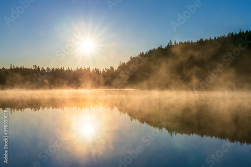 Sunrsise at the lake with morning fog © Pawel Pajor