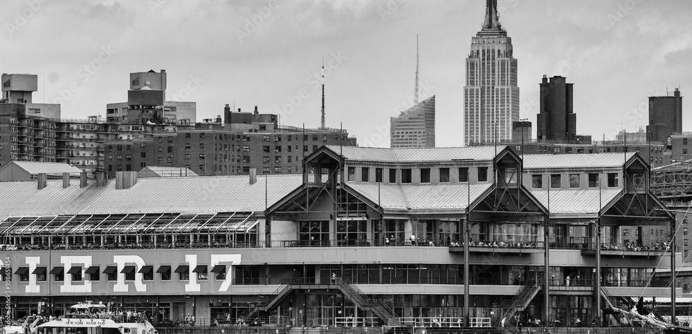 NEW YORK CITY - JUNE 2013: Pier 17 exterior view and Manhattan skyline