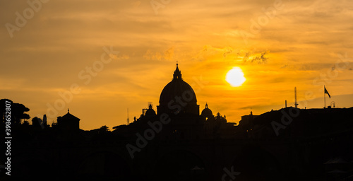 Sunset silhouette of St. Peter's basilica in Vatican. Italy