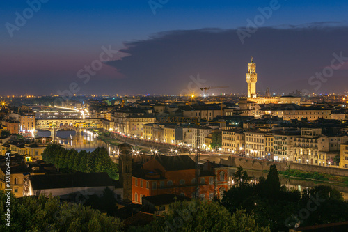 Night view of Florence city skyline with Arno River and Ponte Vecchio