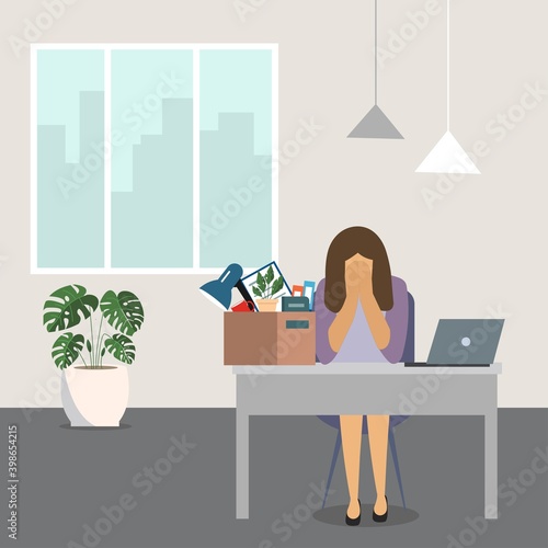 Dismissal concept.Fired sad young woman with a box of things. The young woman who lost his job. Reduced employee.The concept of layoffs, unemployment and job cuts.