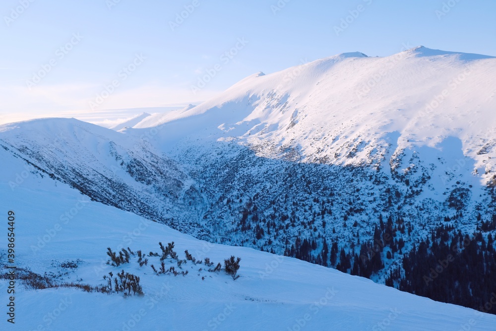 Beautiful mountain winter view during a snowshoe trip from Certovica to Dumbier - the highest peak of the Low Tatras in Slovakia