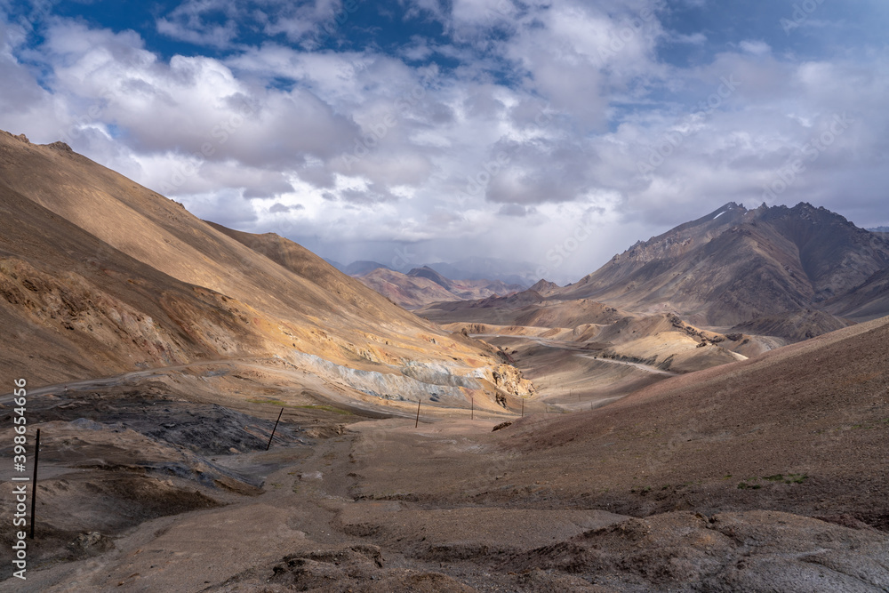 Spectacular painterly pastel view to the south from high-altitude Ak Baital pass, highest on the Pamir Highway, Murghab district in Gorno-Badakshan, Tajikistan Spectacular painterly pastel view to the south from high-altitude Ak Baital pass, highest on the Pamir Highway, Murghab district in Gorno-Badakshan, Tajikistan