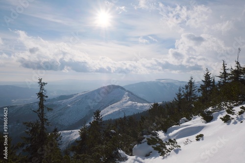 Winter mountain views on red ridge trail from Certovica - Sedlo za Lenivou - Sedlo Homolka during snowshoe tours in Low Tatras in Slovakia photo