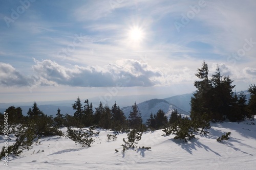 Winter mountain views on red ridge trail from Certovica - Sedlo za Lenivou - Sedlo Homolka during snowshoe tours in Low Tatras in Slovakia