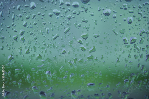 Abstract view of glass surface with many water drops as background close up front view