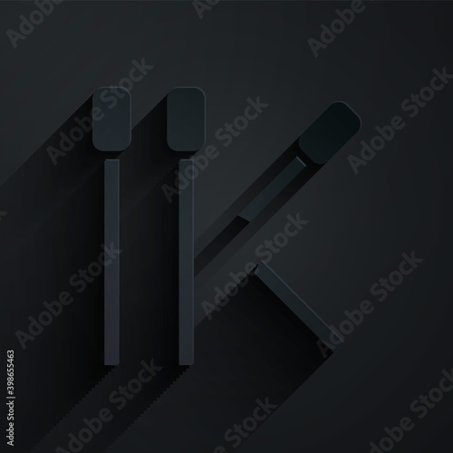 Paper cut Matches icon isolated on black background. Paper art style. Vector.