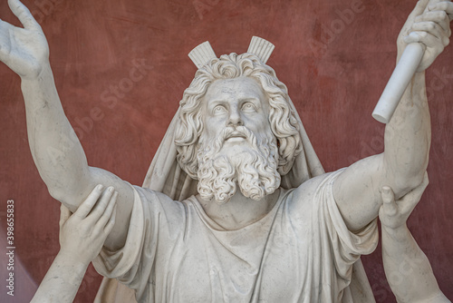 Old statue with prophets in Judaism Moses, Aaron and Hur at the old Church of Peace (Friedenskirche), located at Sanssouci City Park entrance in Potsdam, Germany photo