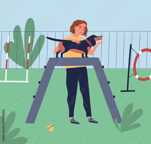Female owner demonstrate or training her dog at playground. Cynologist teach ...