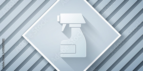 Paper cut Cleaning spray bottle with detergent liquid icon isolated on grey background. Stain remover. Paper art style. Vector.